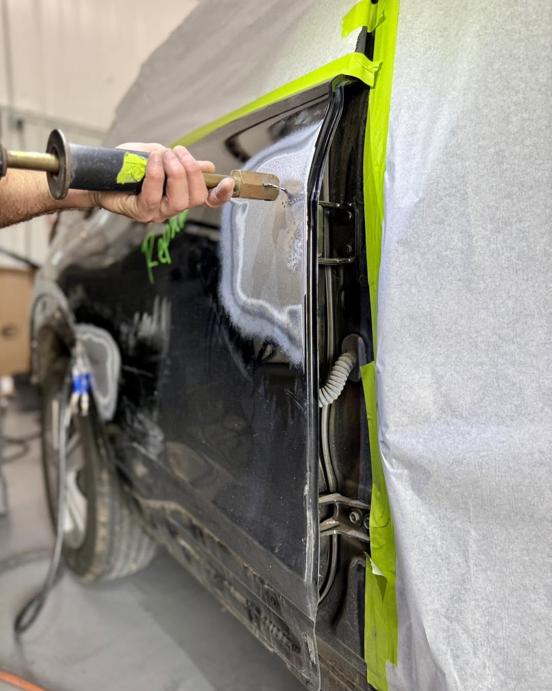 Precision dent pulling on a repaired body panel